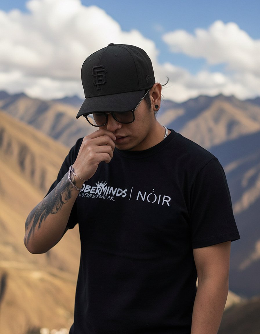 Portrait of Frank.Llashag, tattoo artist at NOIR Tattoo Cusco, specializing in black and grey, color, and surrealism tattoo styles.