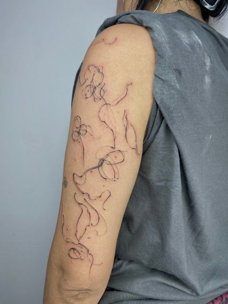 Abstract Floral Sketch Tattoo | Freehand Linework Design by NOIR Tattoo Cusco
