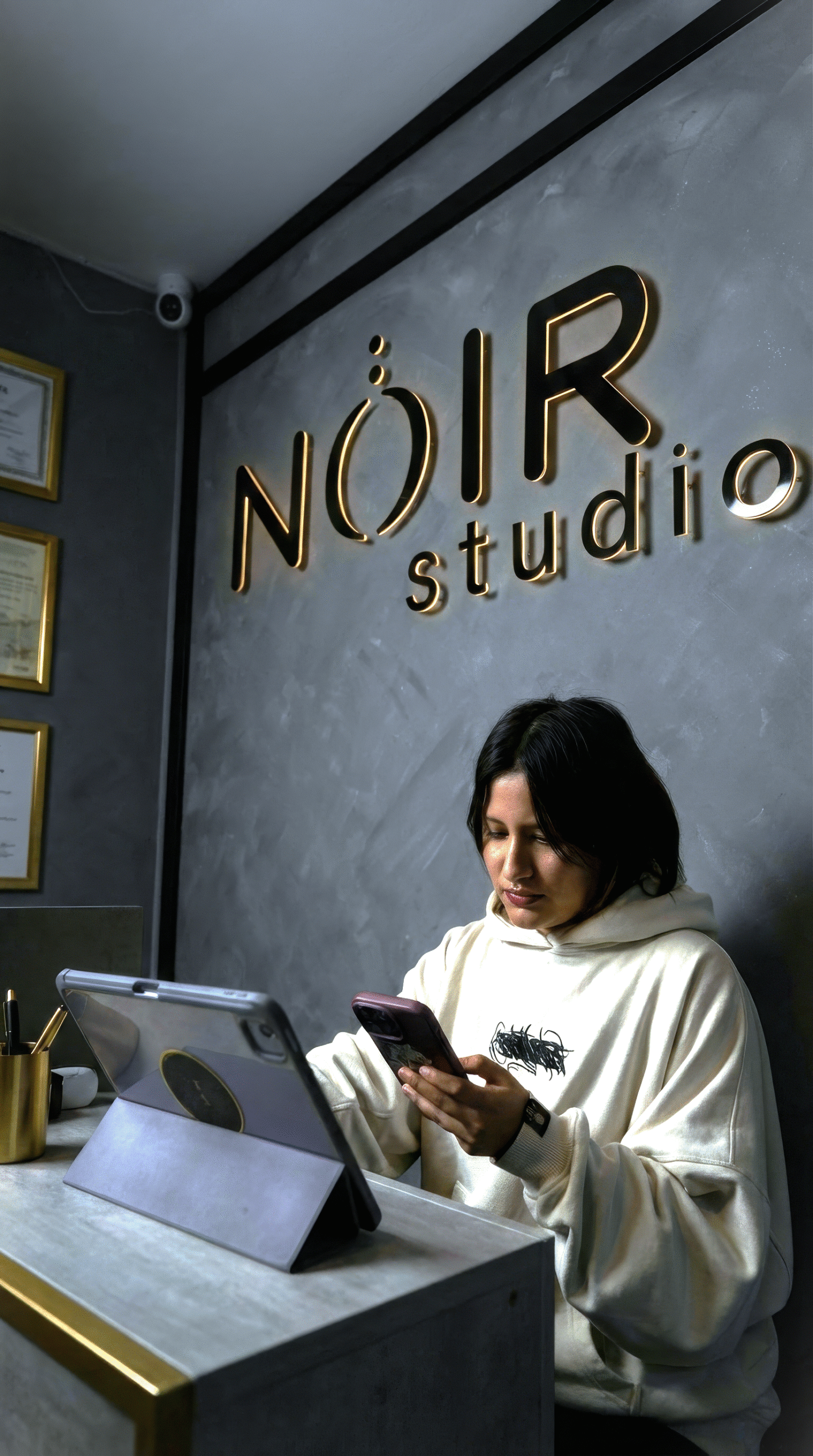 Logo of NOIR Tattoo Cusco displayed on the studio wall, showcasing the artistic and modern atmosphere of the tattoo studio in Cusco, Peru.