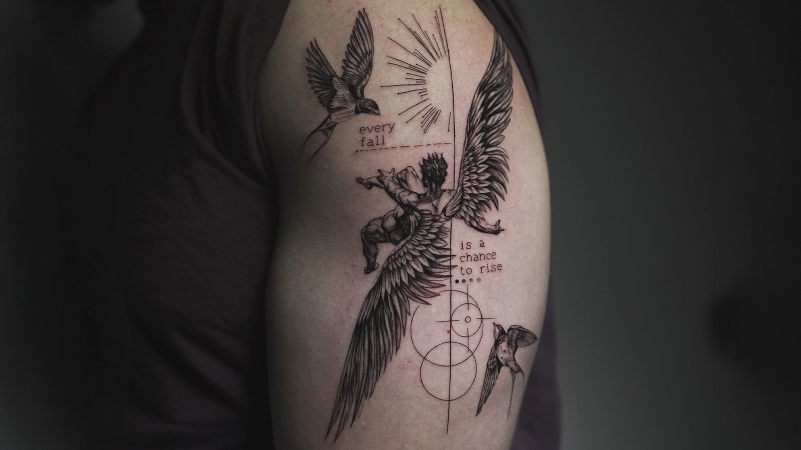 Fine line fallen angel tattoo with detailed wings, swallows, geometric elements, and the quote "Every fall is a chance to rise," created at Noir Tattoo Cusco.