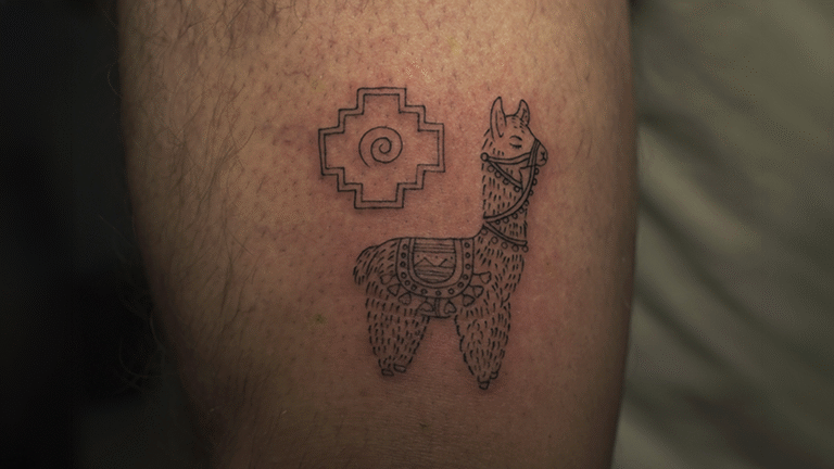 Fine line ornamental llama tattoo with an Andean-inspired symbol created in Cusco, Peru