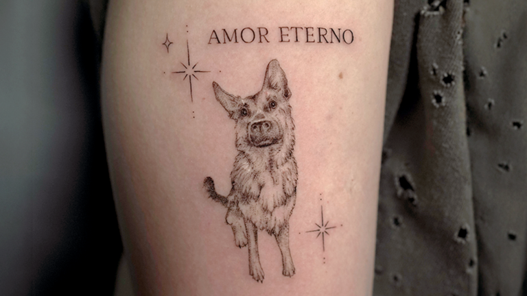 Fine line dog portrait tattoo with Amor Eterno lettering and small stars at Noir Tattoo Cusco
