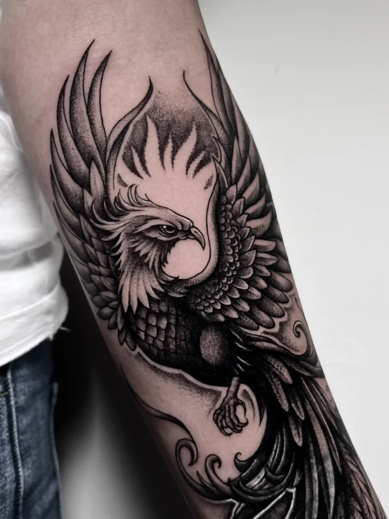 Blackwork bird tattoo on the arm at Noir Tattoo Cusco