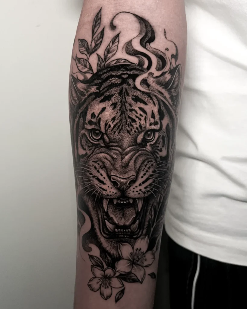 Tiger blackwork tattoo on the arm at Noir Tattoo Cusco